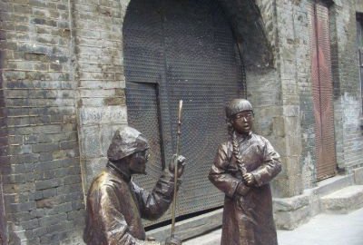 賣(mài)唱人物銅雕塑